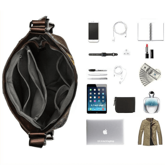 Interior of a full grain leather bag with pockets, featuring smartphone, tablet, notebook, and other everyday items.