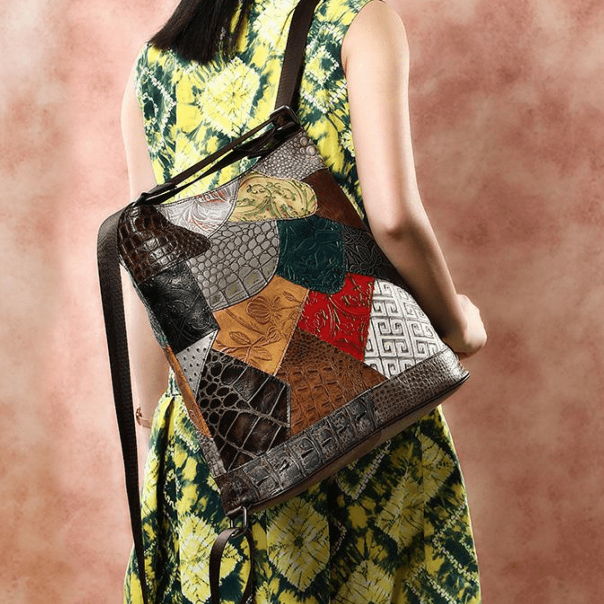 Multicoloured full grain leather bag with side straps worn as a backpack, showcasing intricate patchwork design.
