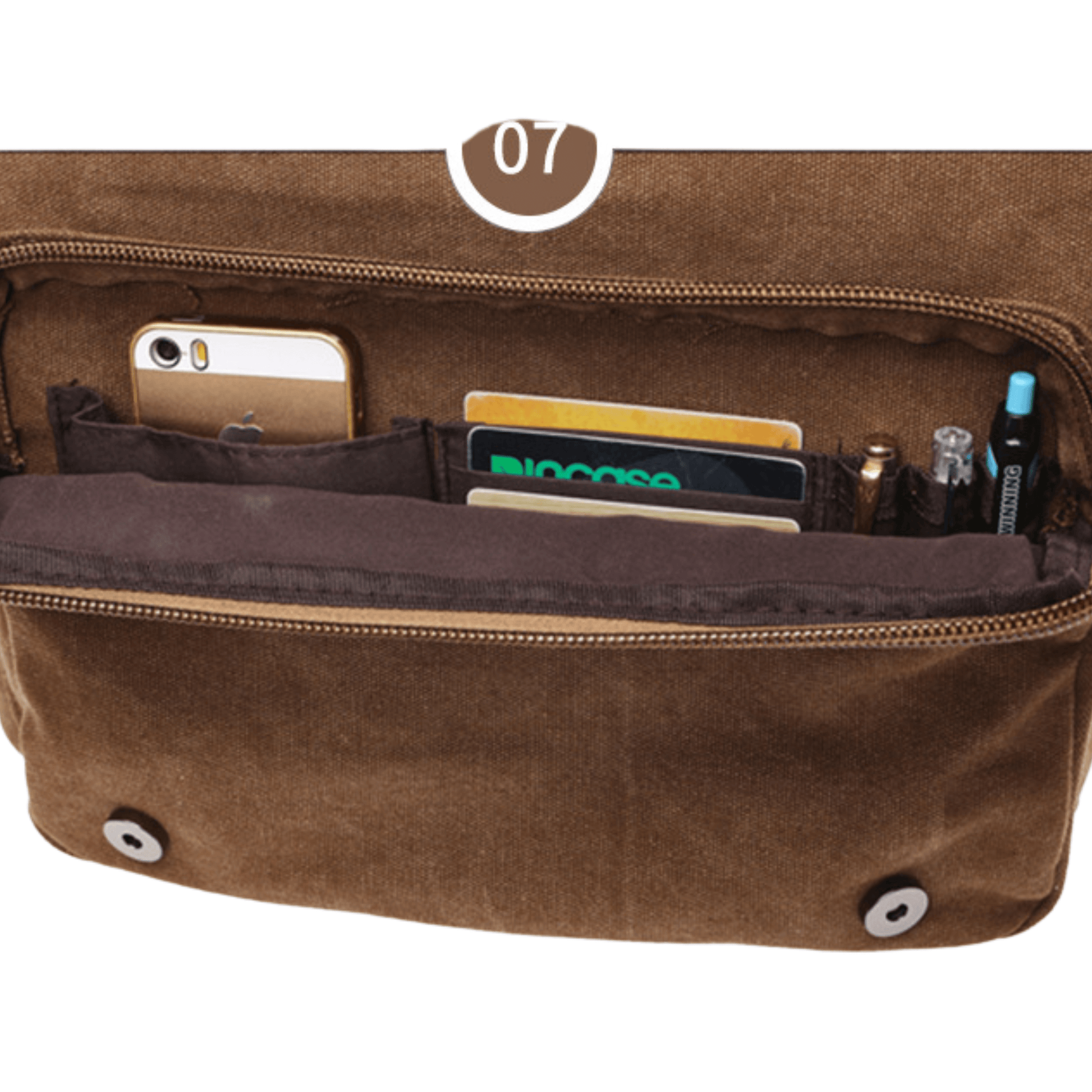 Interior view of a brown canvas messenger bag displaying pockets for phone, credit cards, and pens.