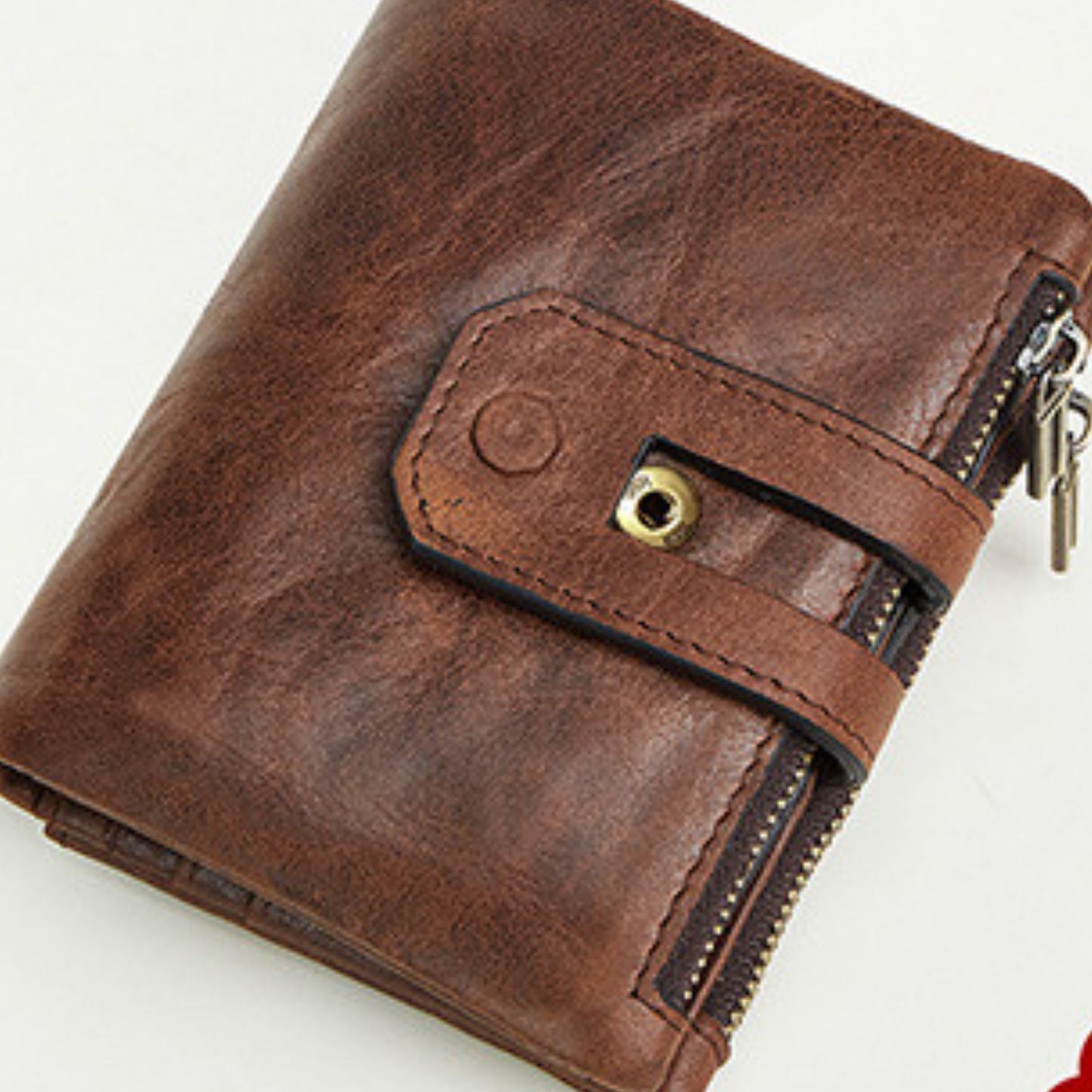 Genuine leather compact cash coin wallet in brown with double stud closure and external zipper pockets.