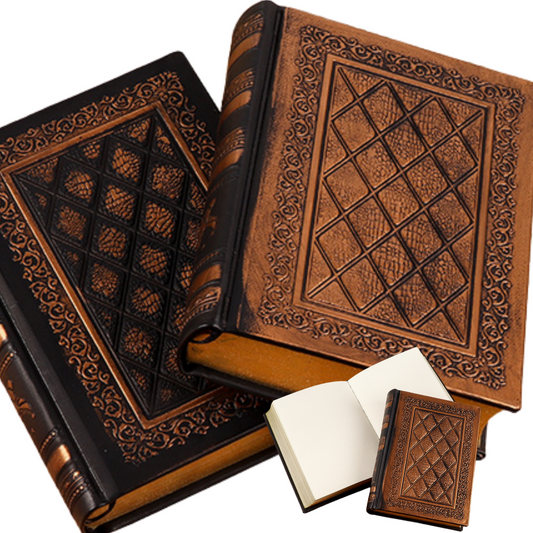 Handmade hard cover travel journals in black and brown with embossed designs and blank pages for journaling or sketching.