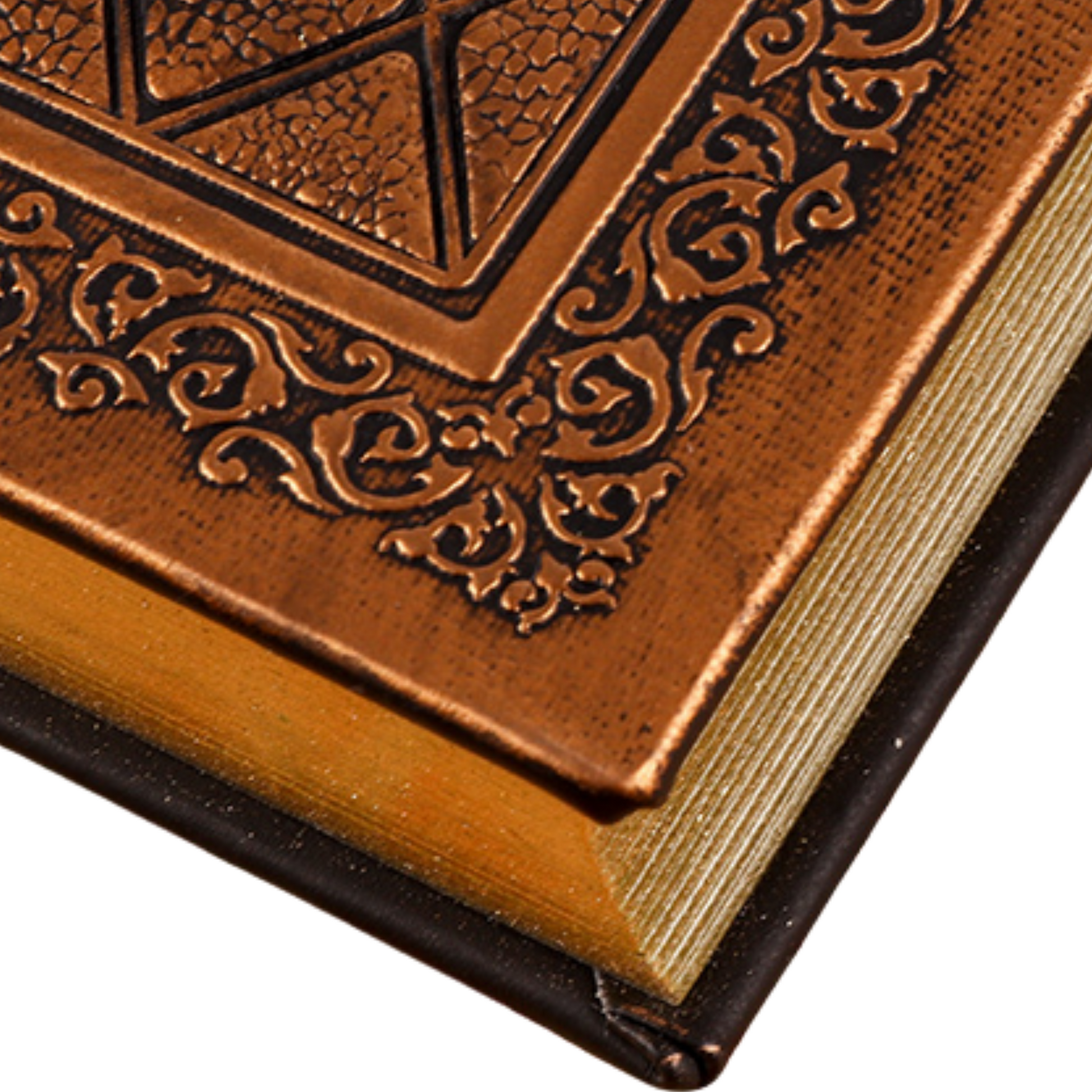 Close-up of a handmade travel journal cover with intricate design and gold edges, showcasing luxurious craftsmanship.