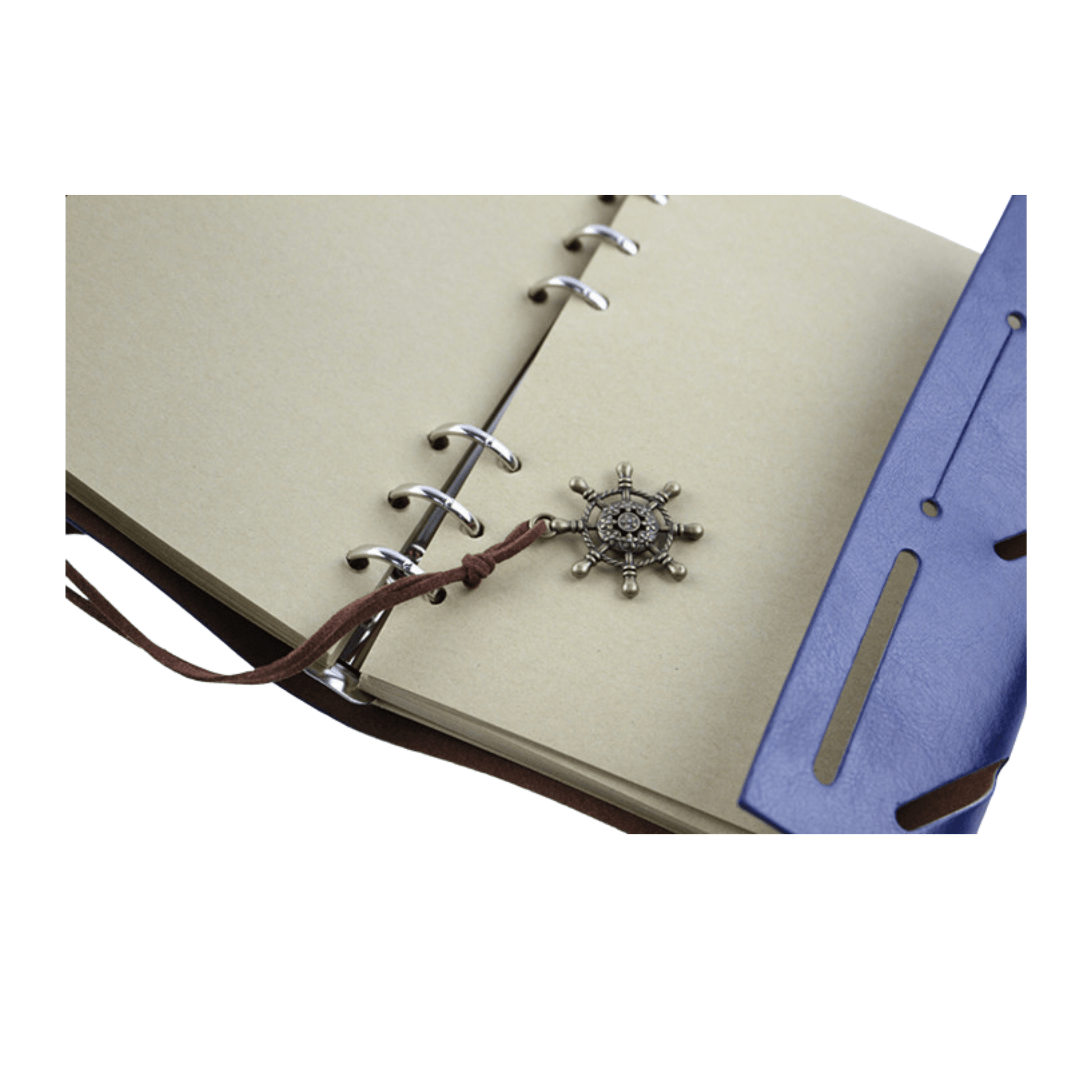 Close-up of a leather bound journal with a decorative insignia and metal ring binder, showcasing its craftsmanship.