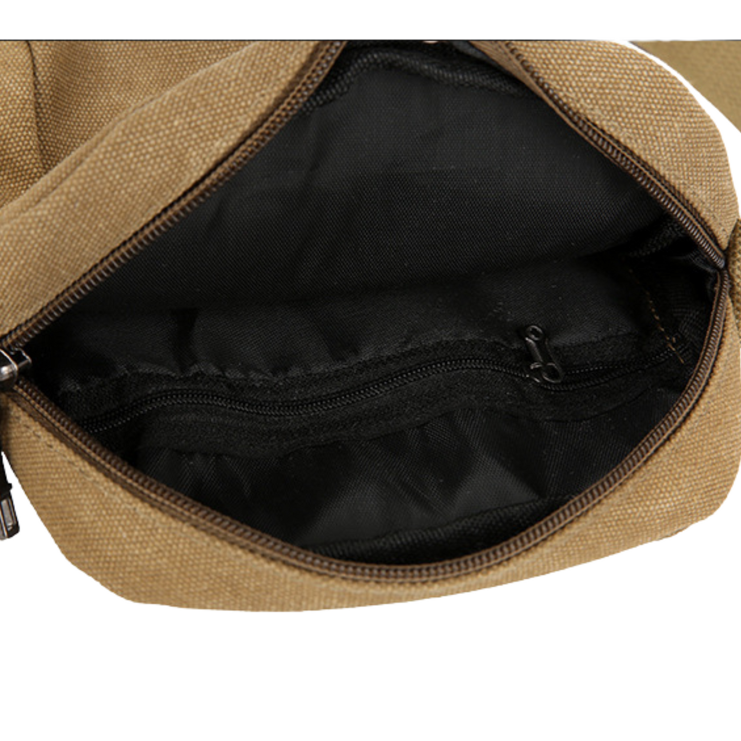 Interior view of a small compact canvas messenger bag showing its zipper pockets for organization.