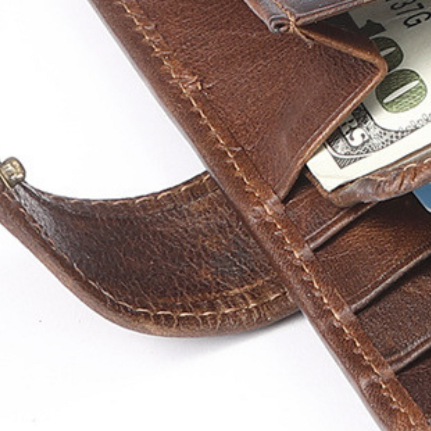 Close-up of top grain genuine leather wallet with cash and card slots, showcasing luxury and functionality.
